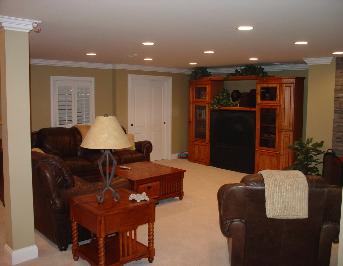 A finished basement with crown Molding