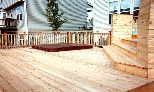 Deck with built in hot tub and custom stair planters
